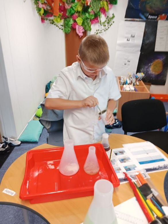 Pupil in a Science Class with a science experiment 